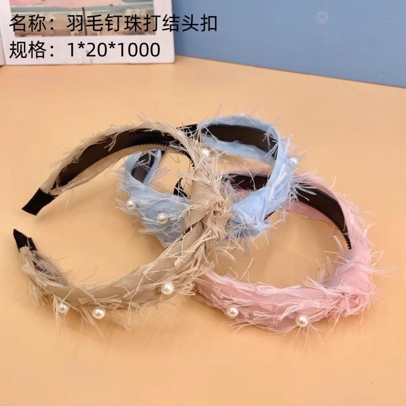 Feather beaded knotted head buckle