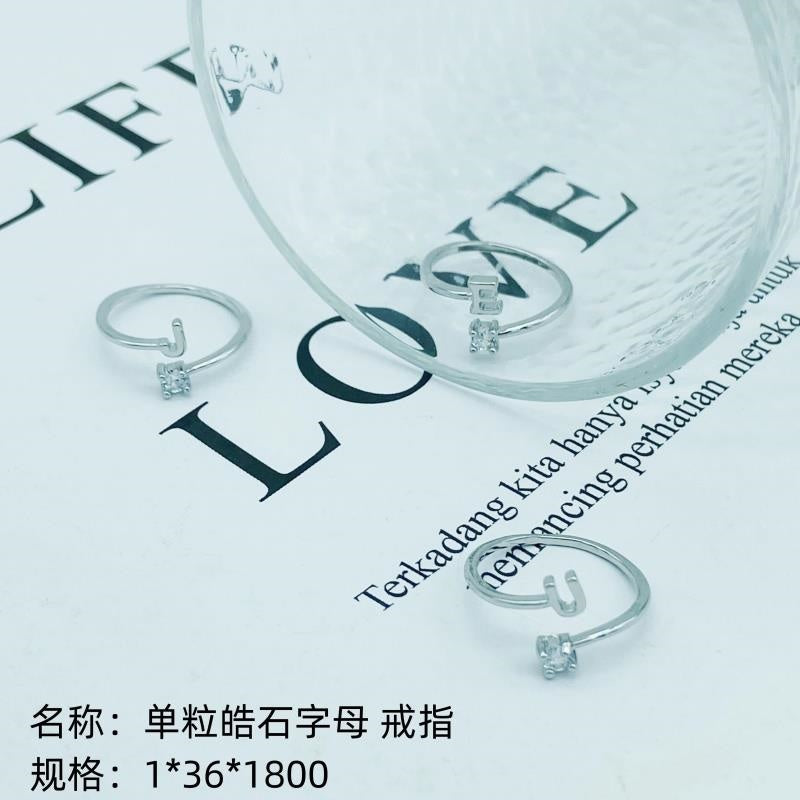 Single-grain zircon letter ring