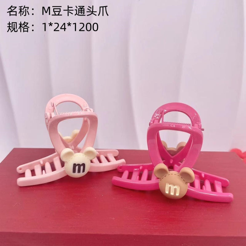M bean cartoon head claw