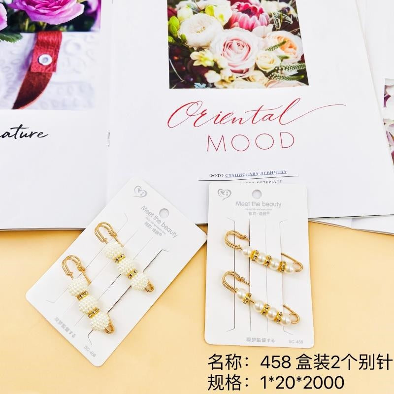 458 boxes, 2 safety pins per box