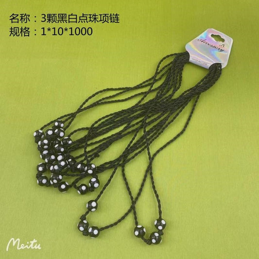3 necklaces with black and white dotted beads