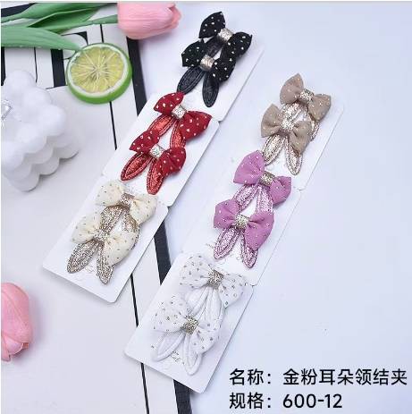 Gold powder ear bow tie clip