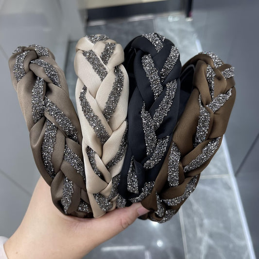 Fabric twisted strip drill bit buckle