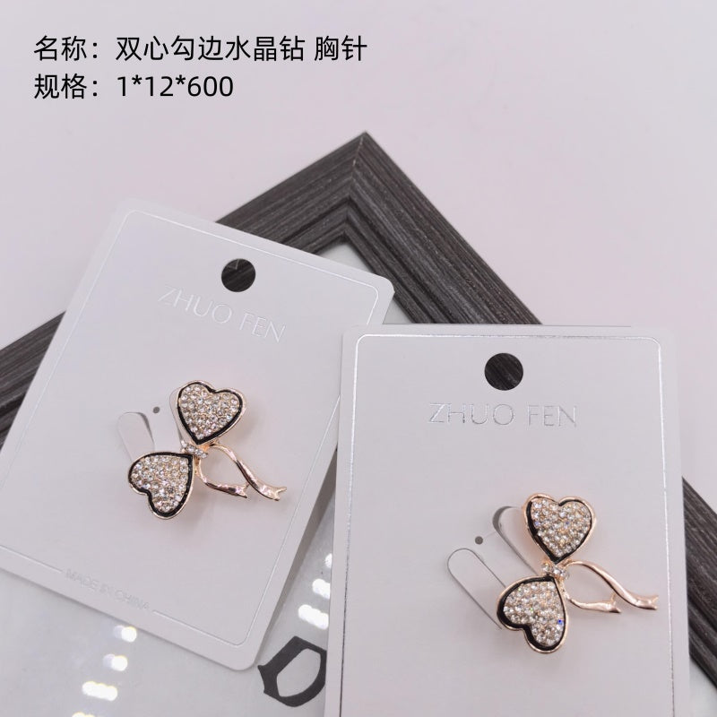 Double-heart outlined crystal diamond brooch