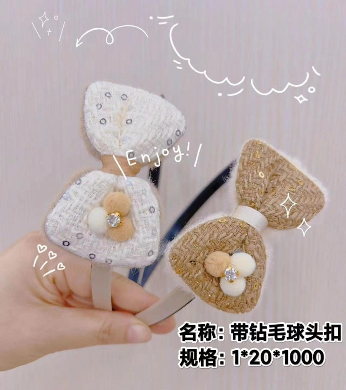 Furry ball buckle with diamond