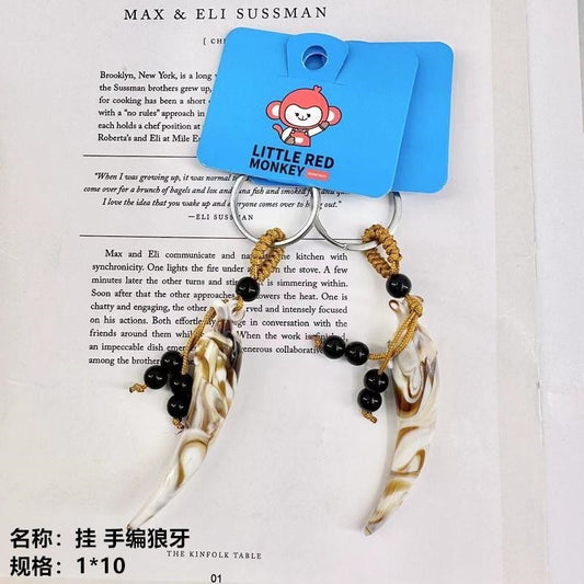 Hang hand - woven wolf teeth