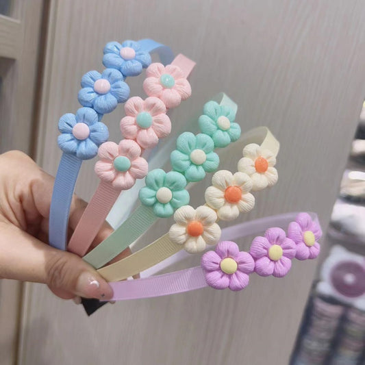 Three small flower - shaped head fasteners