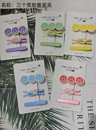 Three smiling face suit clips