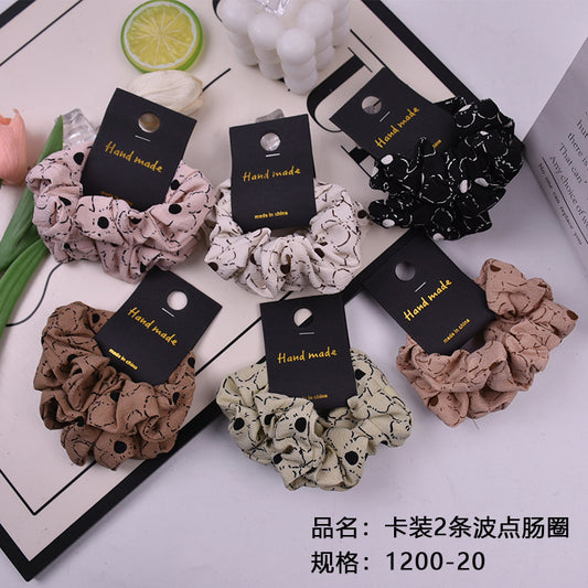 The card contains 2 polka - dot sausage rings