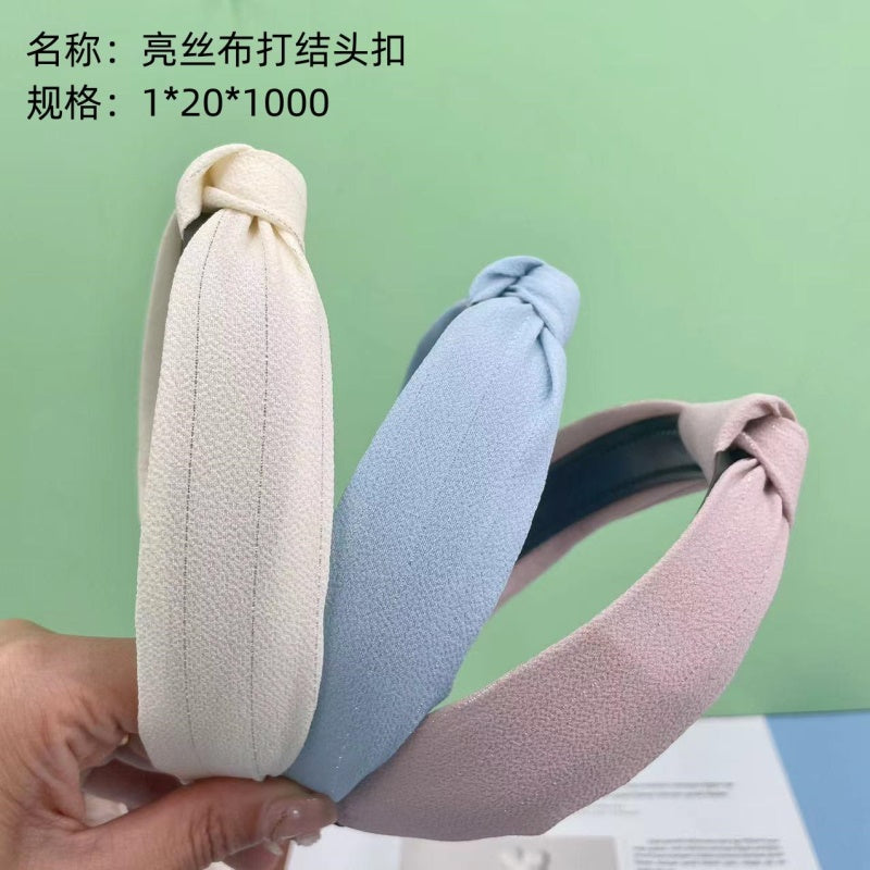 Knot head buckle for shiny silk cloth