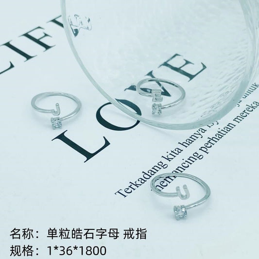Single-grain zircon letter ring