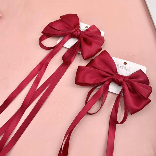 Red ribbon pressing clip