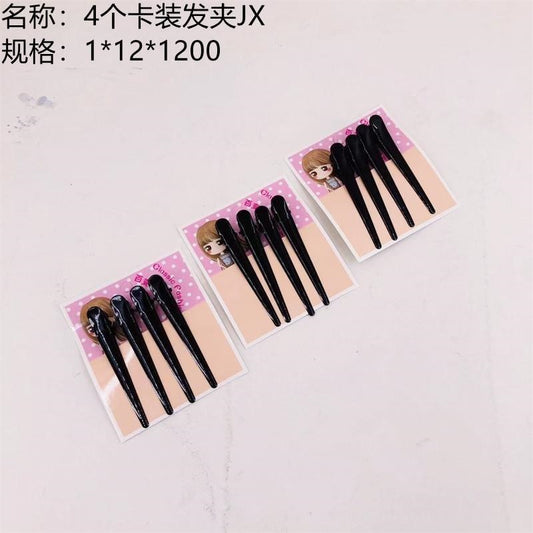 4 hair clips in card packaging