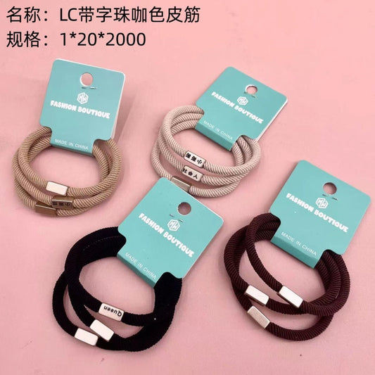 LC brown rubber band with lettering beads