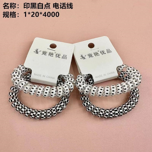 telephone wire with black and white dots printed on it