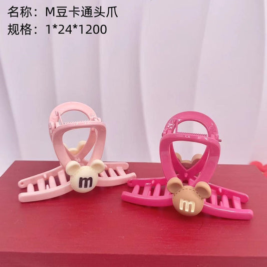 M bean cartoon head claw