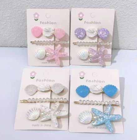 Conjunto de tres piezas con clip de estrella de mar y concha 