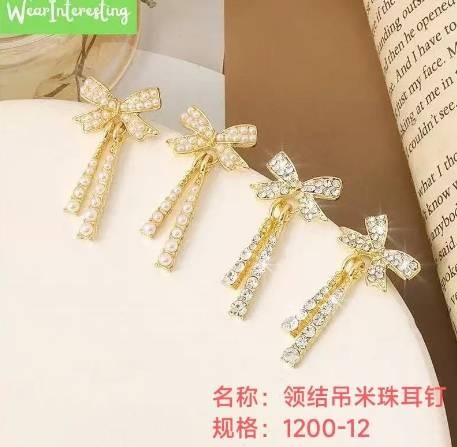 Bow - tie pendant with rice pearls stud earrings