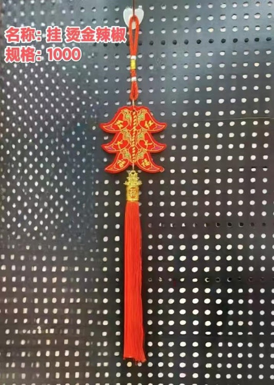Hang up. Gilded chili peppers