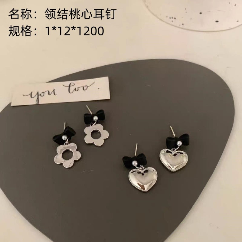 Bow - tie and heart - shaped earrings
