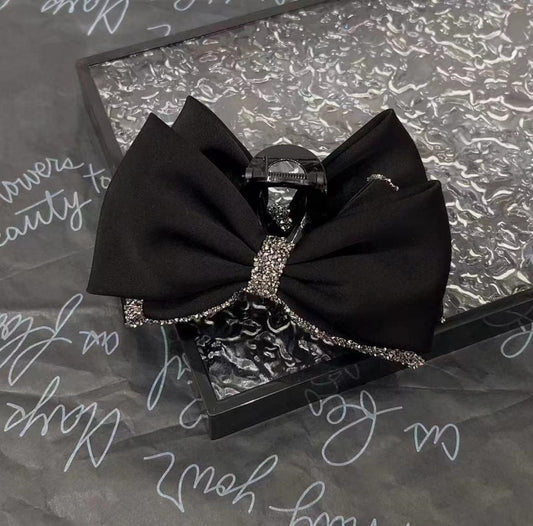 Satin rhinestone bow claw clip